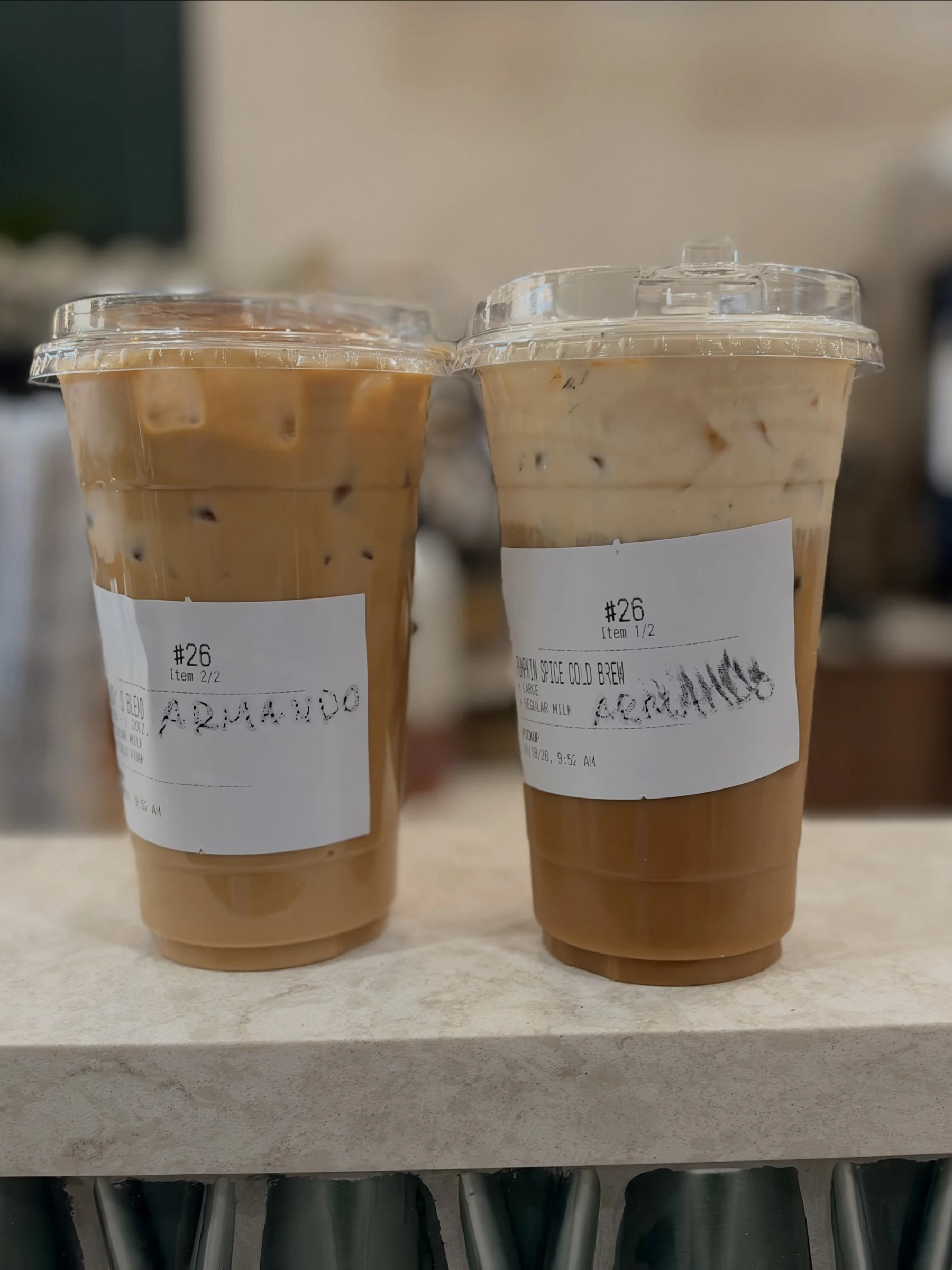 Two iced coffees photographed on the café’s counter