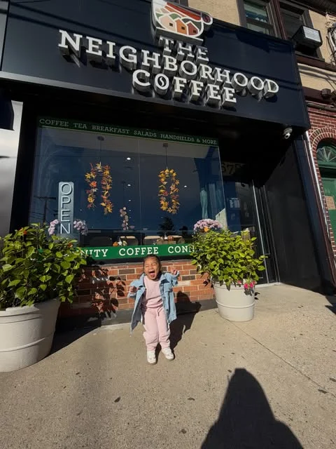 The Neighborhood Coffee sign and storefront on Woodfield Road